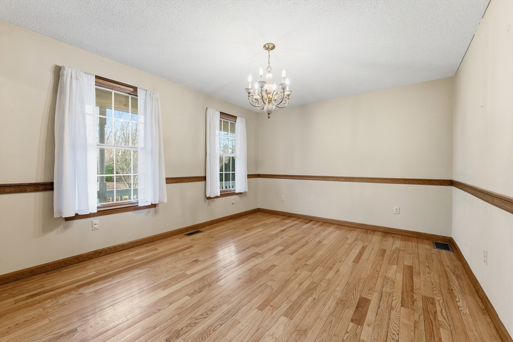 155 South Monson Road Hampden, MA 01036 - Photo 19 of 42 a view of an empty room with wooden floor and a window