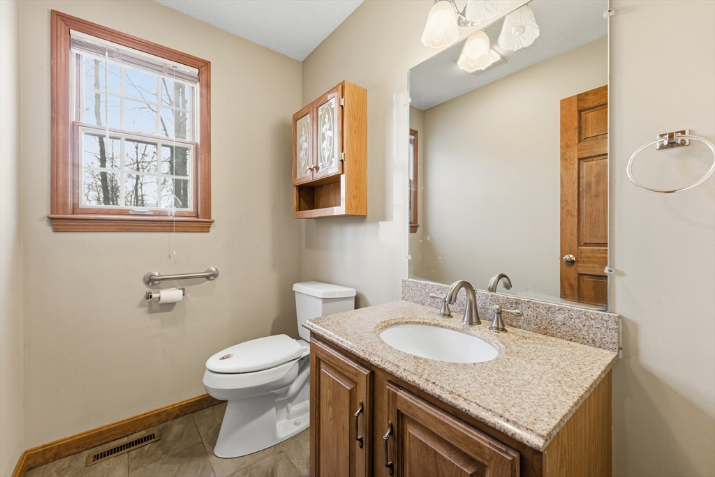 155 South Monson Road Hampden, MA 01036 - Photo 21 of 42 a bathroom with a granite countertop sink toilet and mirror