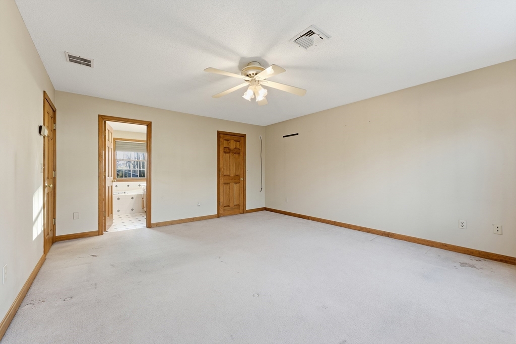 155 South Monson Road Hampden, MA 01036 - Photo 23 of 42 a view of a room with a ceiling fan and a window