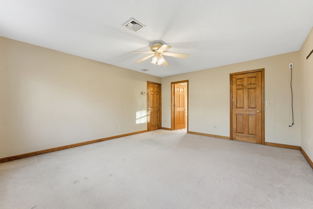 155 South Monson Road Hampden, MA 01036 - Photo 34 of 42 an empty room with chandelier fan and windows