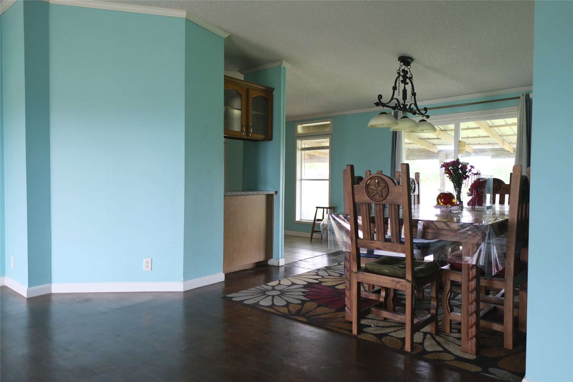 10912 Farm To Market Road 523 Angleton, TX 77515 - Photo 3 of 10 a view of a dining room with furniture window and wooden floor