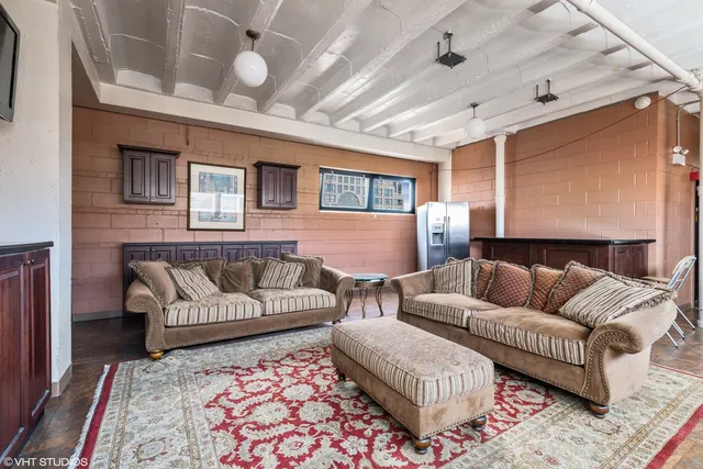 a living room with furniture and a rug