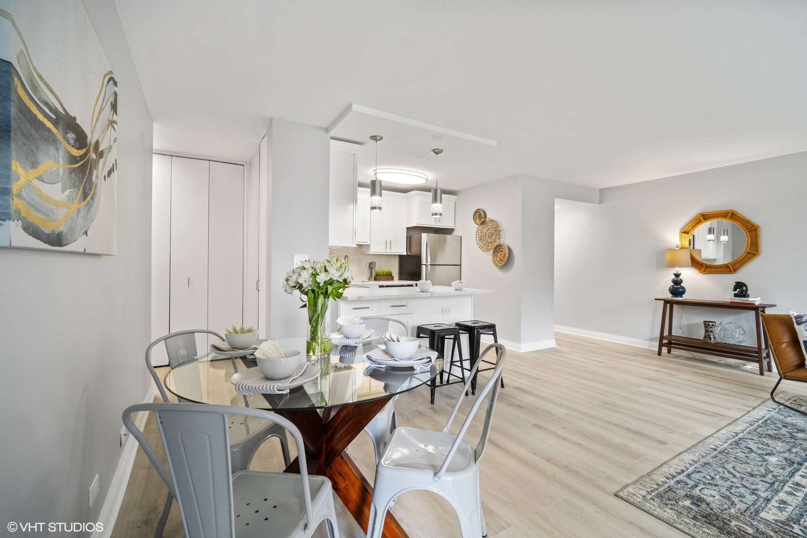 33 East Cedar Street, Unit 8H Chicago, IL 60611 - Photo 4 of 17 a view of a dining room with furniture and wooden floor