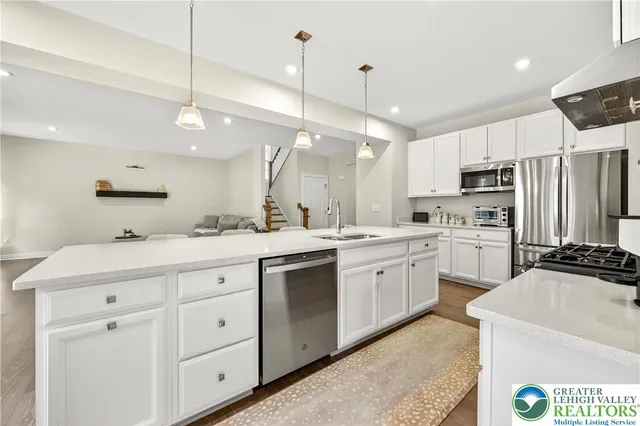 a white toilet sitting next to a shower