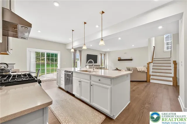 a bathroom with a sink a mirror and shower