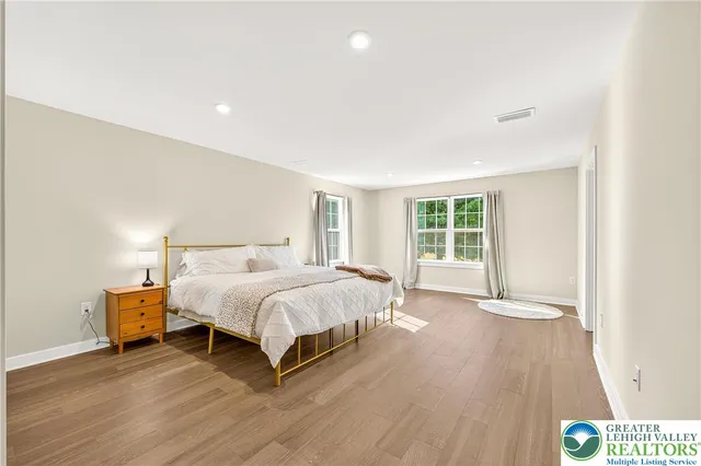 a white toilet sitting next to a shower