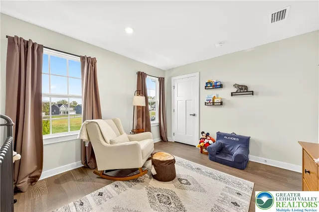 a bathroom with a double vanity sink toilet mirror and shower
