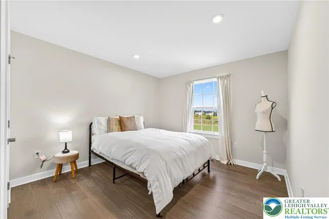 a bed room with a toys and wooden floor