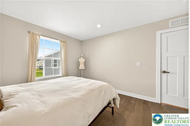 a view of a patio with table and chairs and potted plants