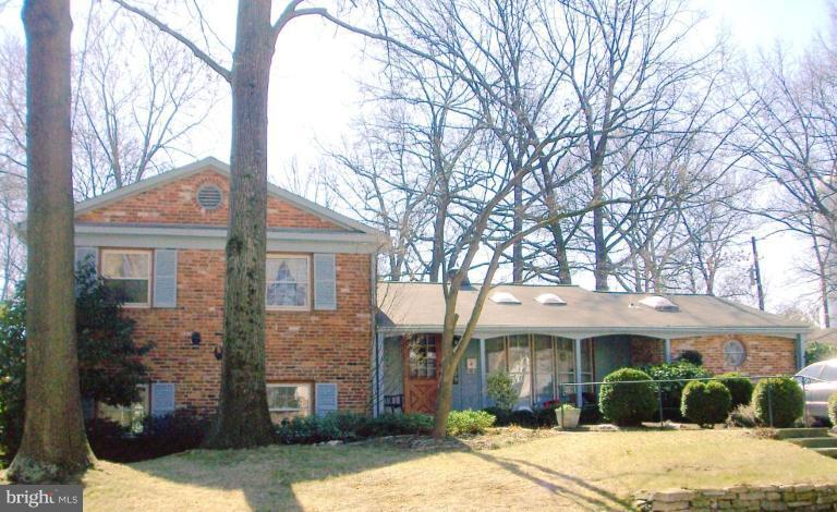 1499 Kimblewick Road Potomac, MD 20854 - Photo 1 of 17 a front view of a house with garden