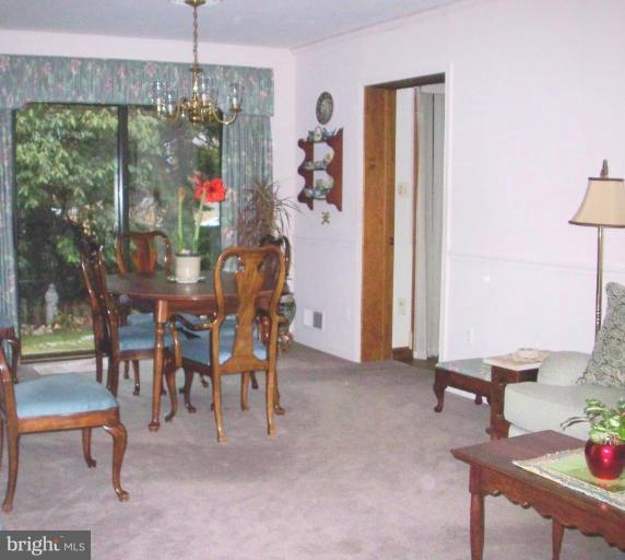 1499 Kimblewick Road Potomac, MD 20854 - Photo 2 of 17 a view of a dining room with furniture window and outside view