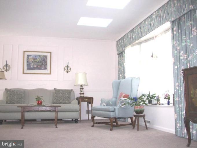 1499 Kimblewick Road Potomac, MD 20854 - Photo 17 of 17 a living room with furniture and a window
