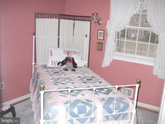 1499 Kimblewick Road Potomac, MD 20854 - Photo 6 of 17 a view of a bedroom with a bed