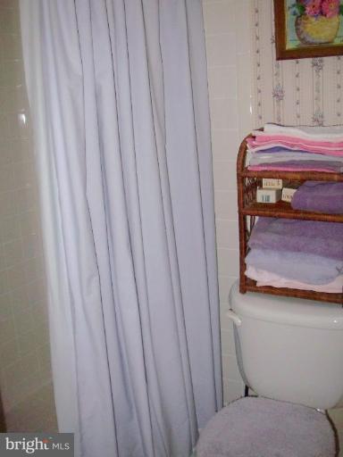 1499 Kimblewick Road Potomac, MD 20854 - Photo 8 of 17 a bathroom with a toilet and a sink
