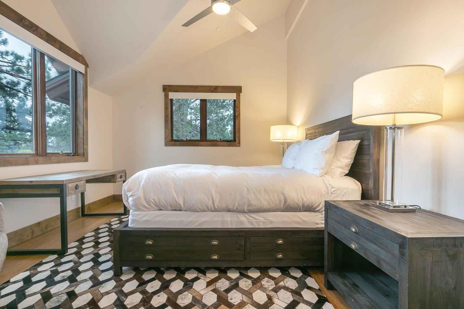 11655 Henness Road Truckee, CA 96161 - Photo 18 of 21 a bedroom with a bed and a lamp on table