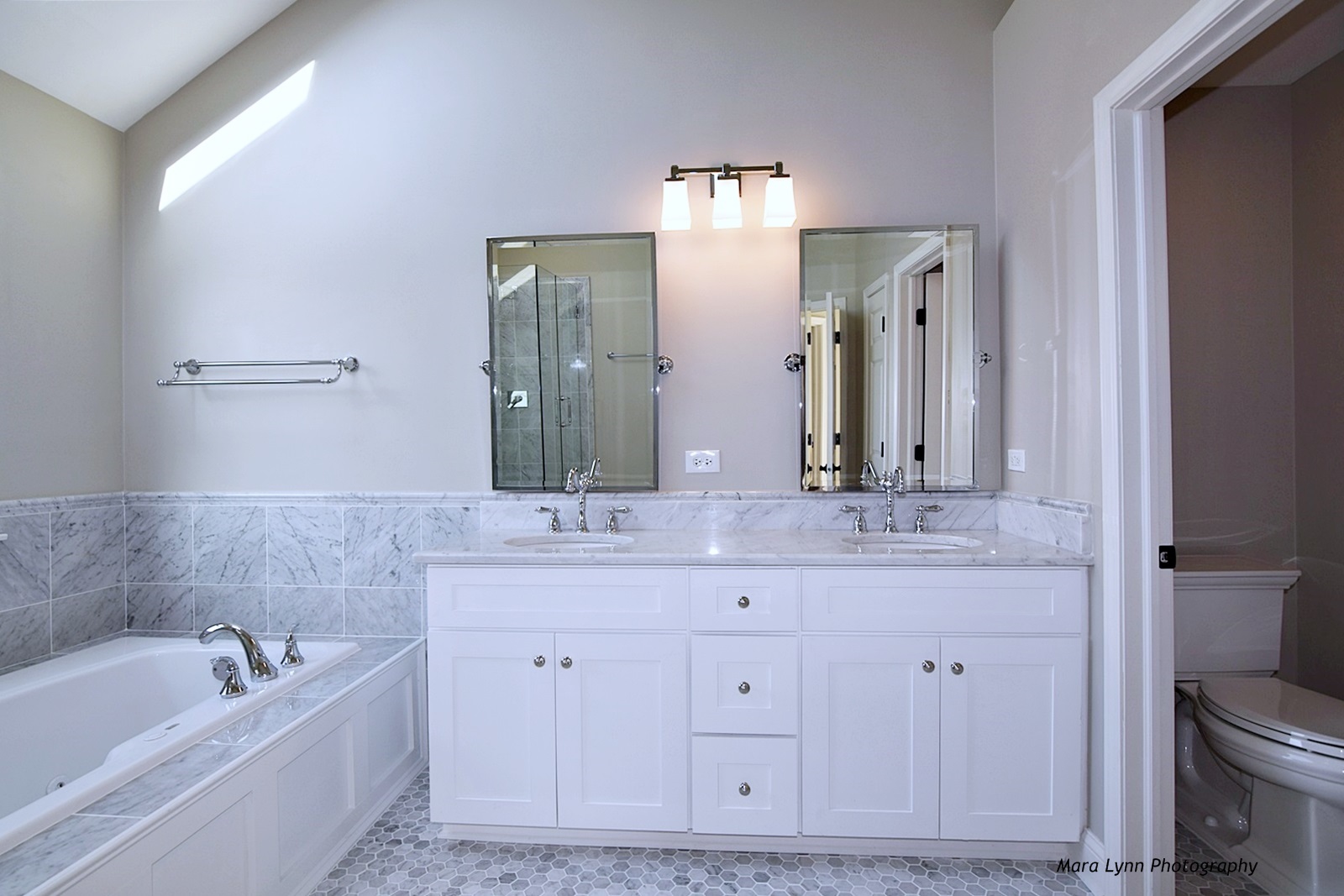 2231 Fargo Boulevard Geneva, IL 60134 - Photo 16 of 24 a bathroom with a granite countertop double vanity sink a mirror and a bathtub