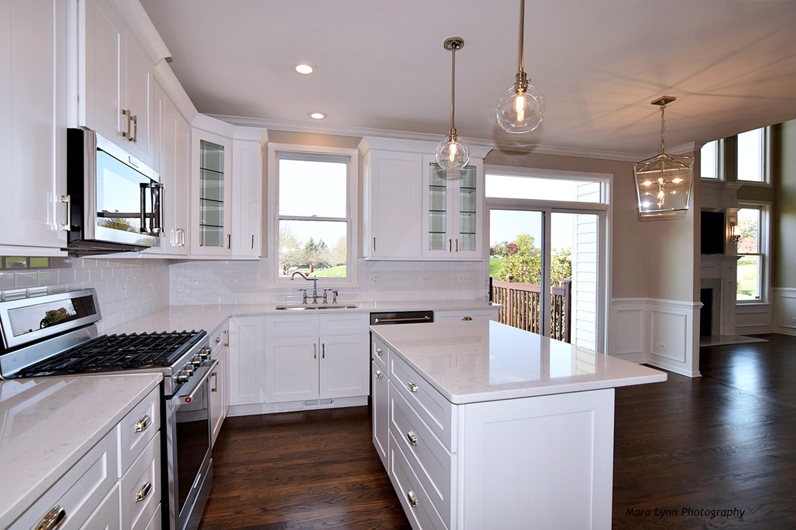 2231 Fargo Boulevard Geneva, IL 60134 - Photo 4 of 24 a kitchen with a sink stove and wooden cabinets