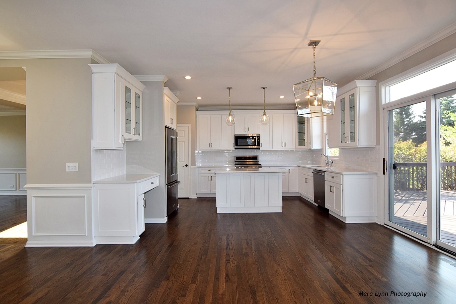 2231 Fargo Boulevard Geneva, IL 60134 - Photo 6 of 24 a large kitchen with white cabinets and wooden floor