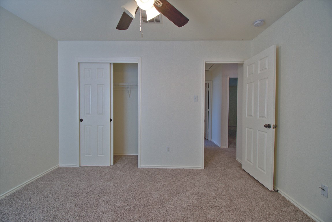 3112 Blue Ridge Drive Round Rock, TX 78681 - Photo 16 of 22 a view of an empty room and chandelier fan