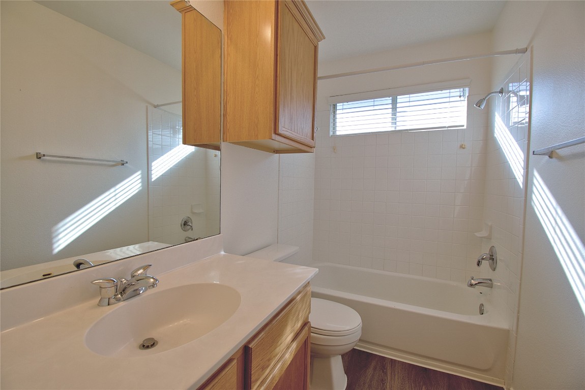 3112 Blue Ridge Drive Round Rock, TX 78681 - Photo 17 of 22 a bathroom with a sink toilet and shower