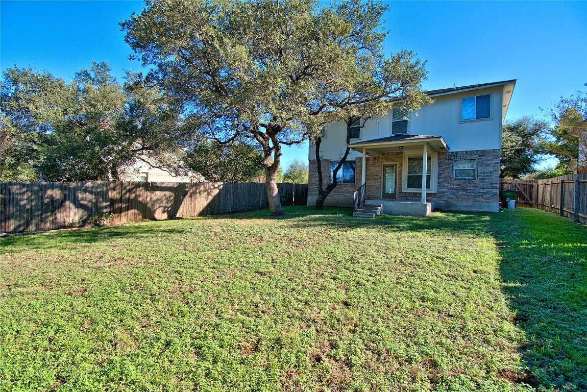 3112 Blue Ridge Drive Round Rock, TX 78681 - Photo 21 of 22 front view of a house with a yard