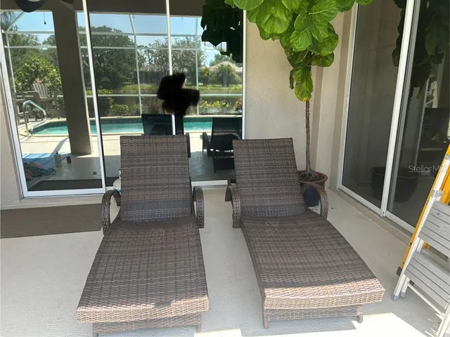 a view of a glass door with a yard