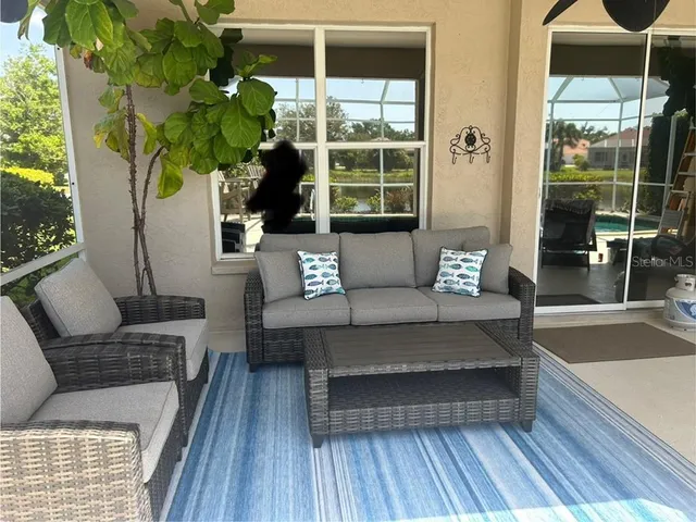 a view of a roof deck with table and chairs with wooden floor