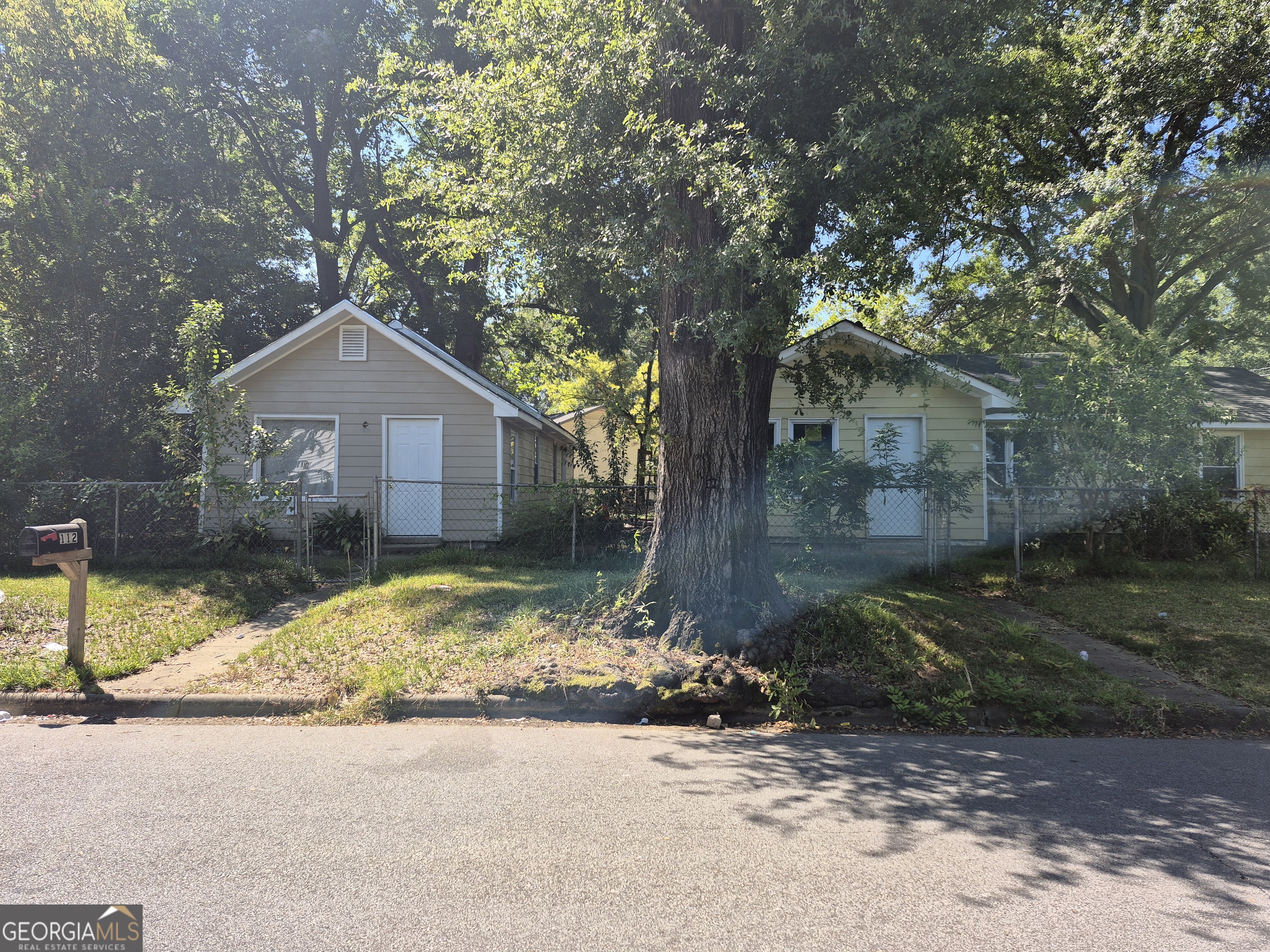 110 31st Avenue Columbus, GA 31903 - Photo 2 of 6 a front view of a house with garden