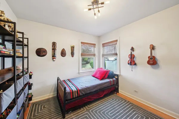 a bedroom with furniture and a window