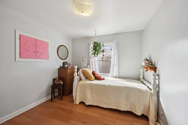 a bedroom with bed and a window