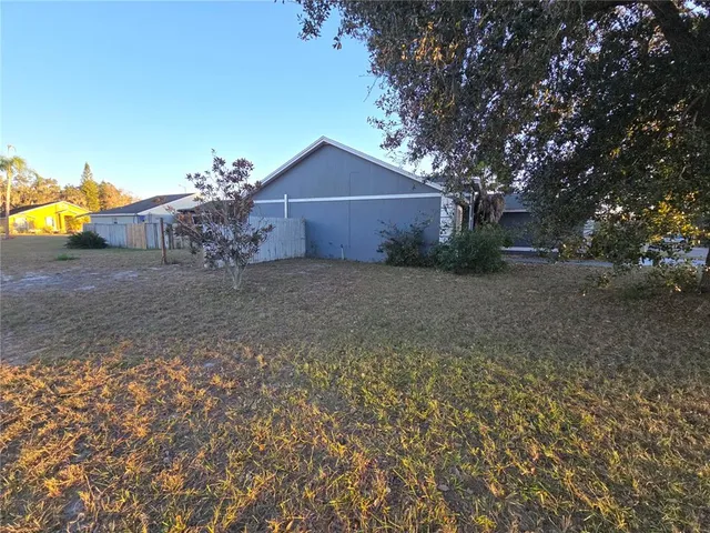 a wooden house with trees in front of it