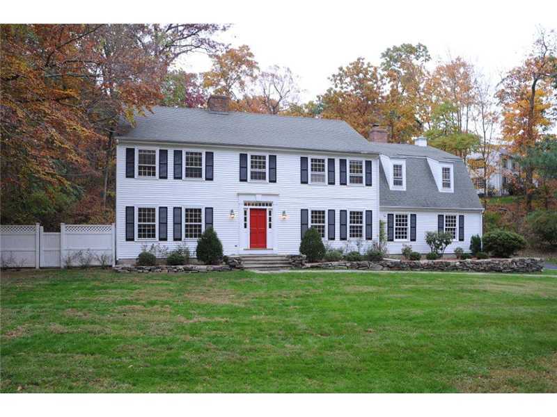 71 Delafield Island Road Darien, CT 06820 - Photo 1 of 25 a house that is sitting in a big yard with large trees