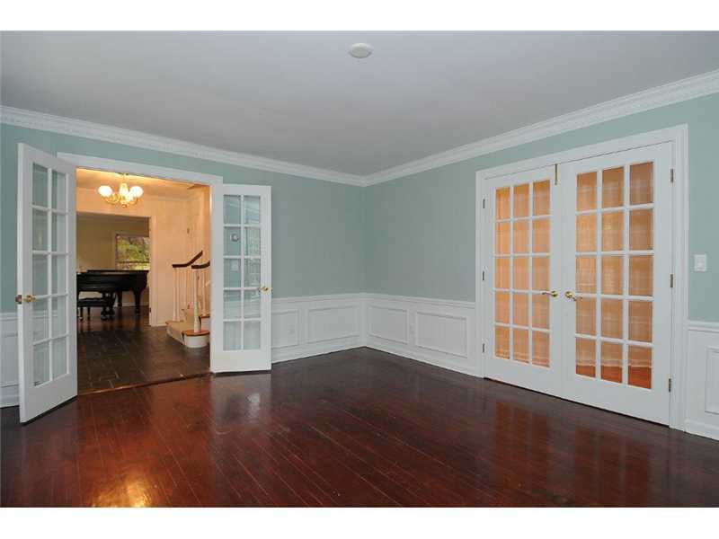 71 Delafield Island Road Darien, CT 06820 - Photo 11 of 25 a view of empty room with wooden floor and fan