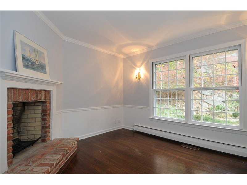 71 Delafield Island Road Darien, CT 06820 - Photo 12 of 25 a view of an empty room with wooden floor and a window