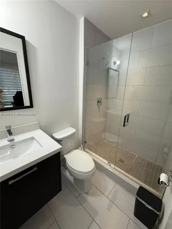 a living room with couch and a large window