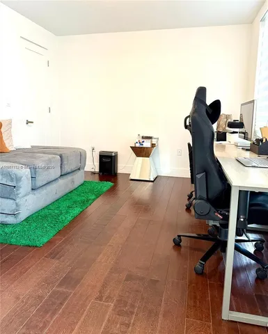 a view of a swimming pool with outdoor seating