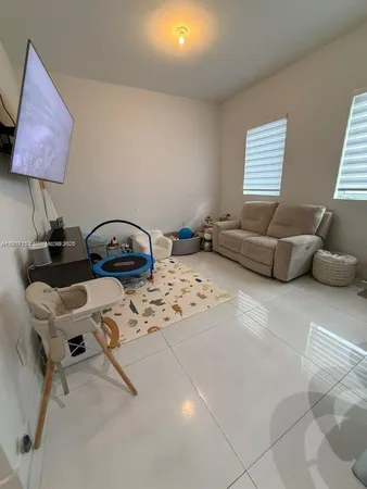 a room with furniture and a flat screen tv