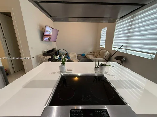 a room with furniture and a flat screen tv