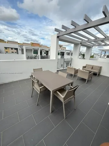 a bathroom with a double vanity sink toilet and shower