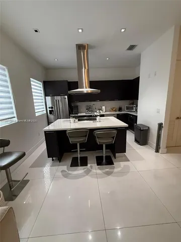 a white toilet sitting next to a bathroom sink