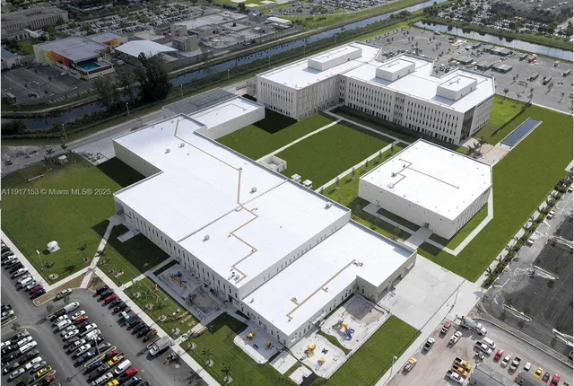 a view of swimming pool with palm trees