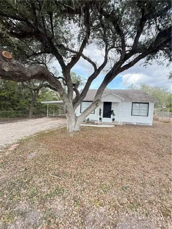 a house with trees in front of it