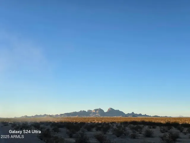 a view of a lake with mountains in the background