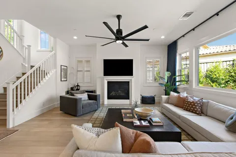a living room with furniture fireplace and a flat screen tv