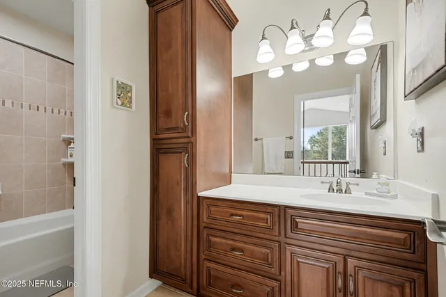 a bathroom with a sink a vanity and a mirror