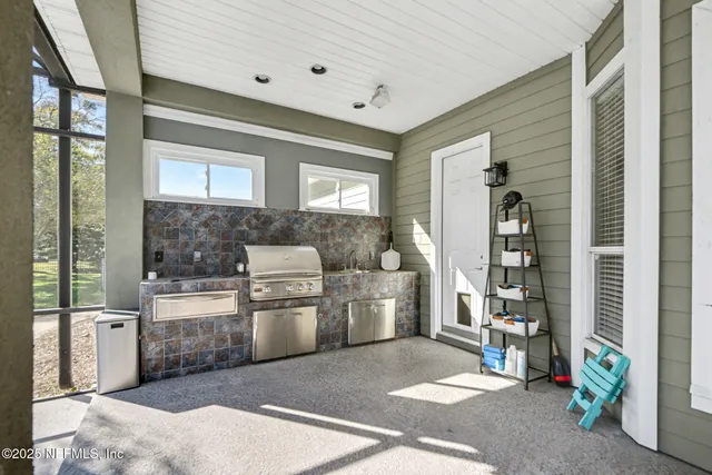a kitchen with a refrigerator and a stove
