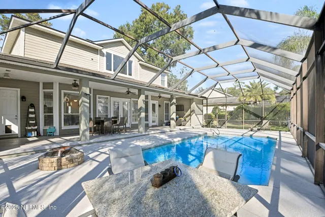 a view of a swimming pool with a patio