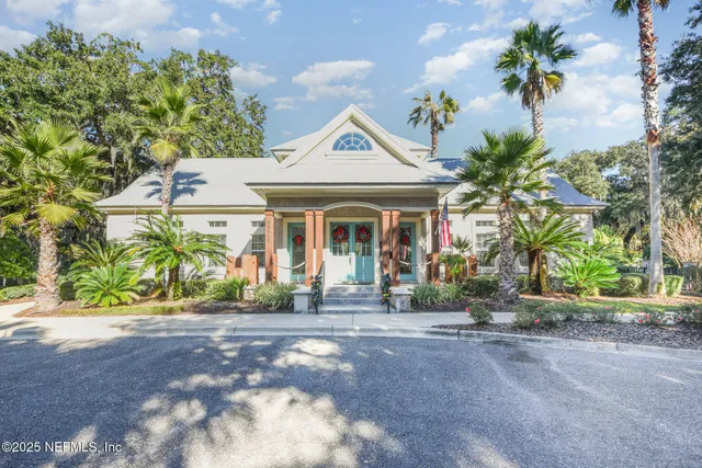 a front view of a house with a yard and a garage