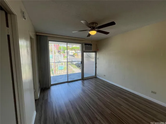a view of a kitchen with wooden floor