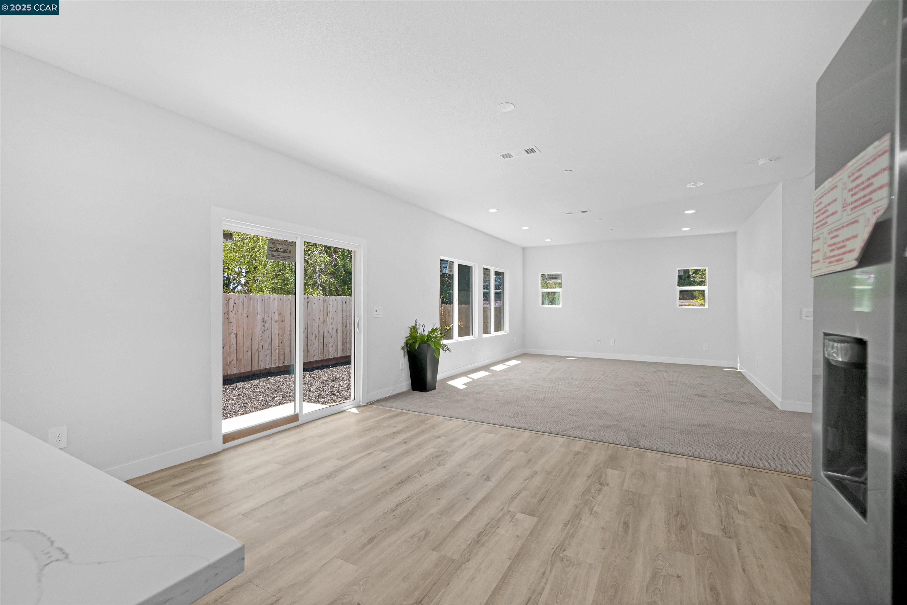2722 Cowell Road Concord, CA 94518 - Photo 16 of 55 a view of livingroom with hardwood floor and a ceiling fan
